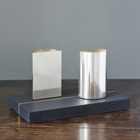 Two Semi-circular Containers on Gilded Slate