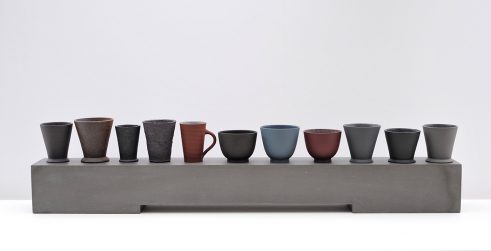 Eleven Cups on a Ground