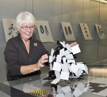 Nel Linssen demonstrating her paper models