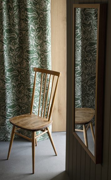 Wren fabric, forest on oatmeal linen union, designed by Mark Hearld