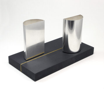 Two Semi-circular Containers on Gilded Slate