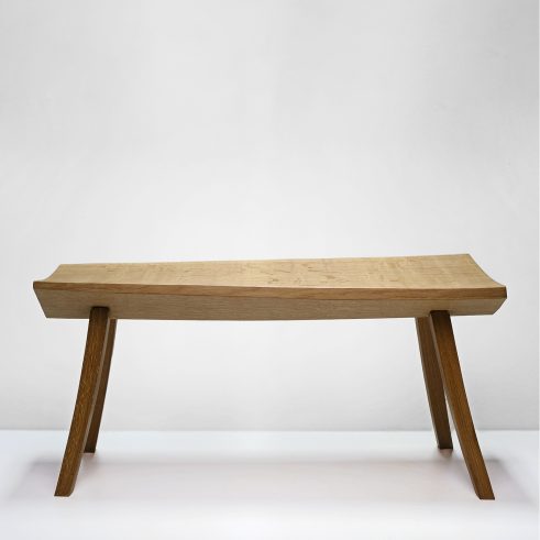 a bench in a white space