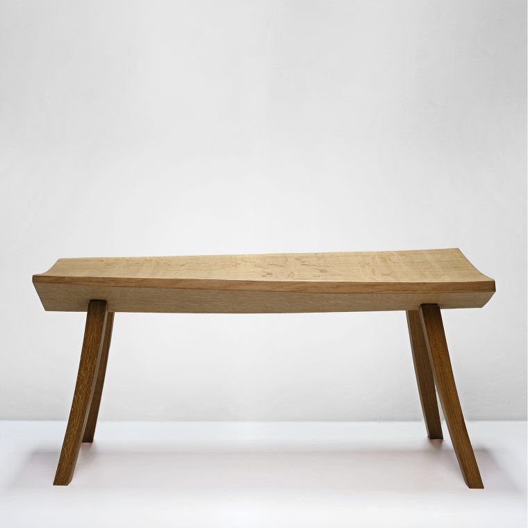 a bench in a white space