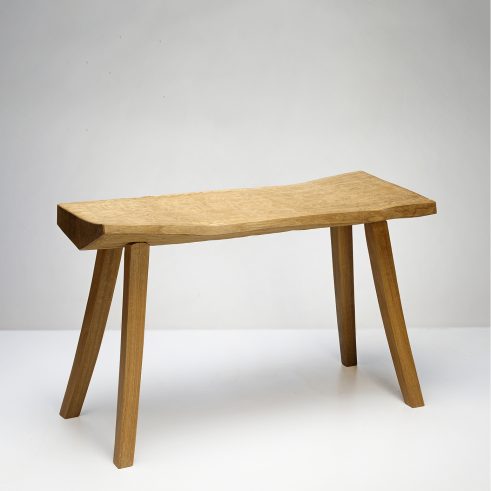 bench made by Adrian McCurdy in a white space