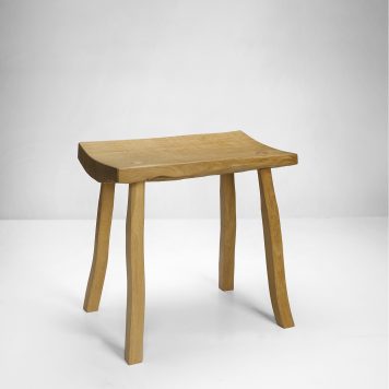 pale oak bench by Adrian McCurdy in a white space