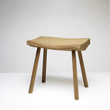 pale oak bench by Adrian McCurdy in a white space