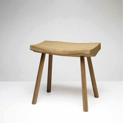 pale oak bench by Adrian McCurdy in a white space
