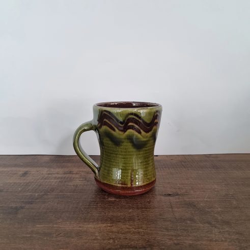 glazed earthenware mug with slip decoration