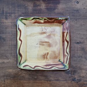 glazed earthenware square dish with slip decoration by Clive Bowen
