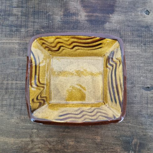 glazed earthenware square dish with slip decoration by Clive Bowen