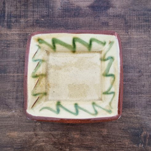 glazed earthenware square dish with slip decoration by Clive Bowen