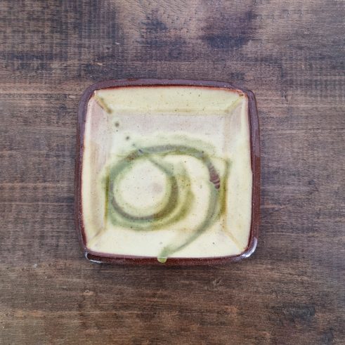 glazed earthenware square dish with slip decoration by Clive Bowen