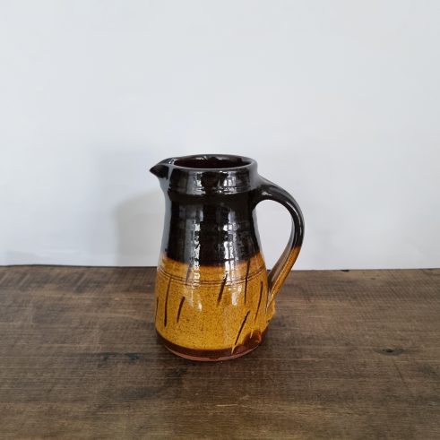 small glazed earthenware jug with slip decoration by Clive Bowen