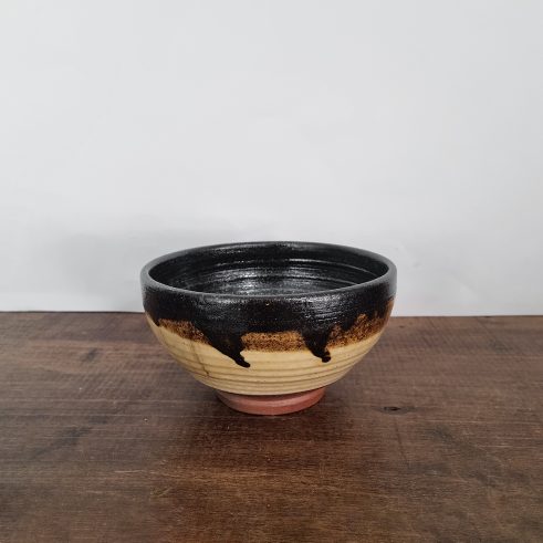 small glazed earthenware bowl with slip decoration by Clive Bowen