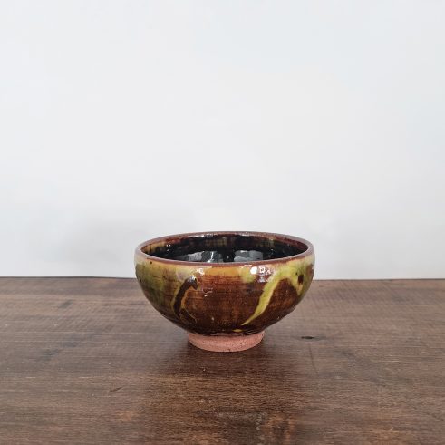 small glazed earthenware bowl with slip decoration by Clive Bowen