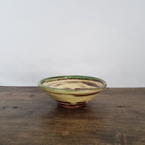 small glazed earthenware bowl with slip decoration by Clive Bowen