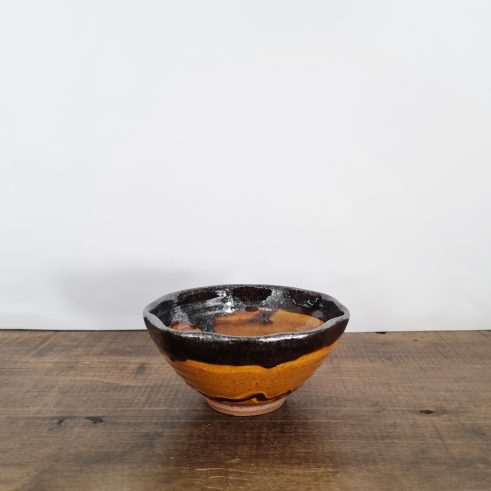 small glazed earthenware wavy bowl with slip decoration by Clive Bowen