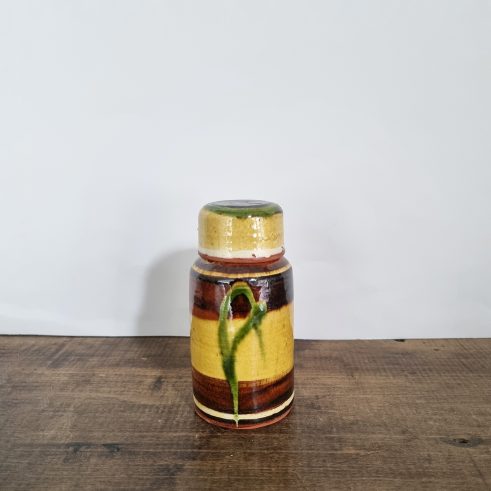 small glazed earthenware lidded jar with slip decoration by Clive Bowen