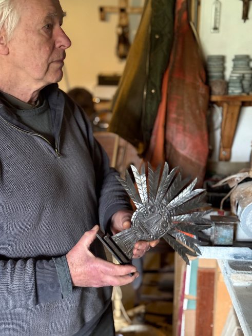 Guy Royle holding Green Man sculpture