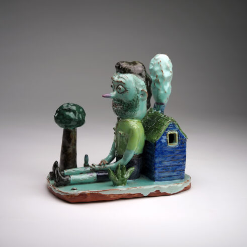 Sitting Man With House And Pipe