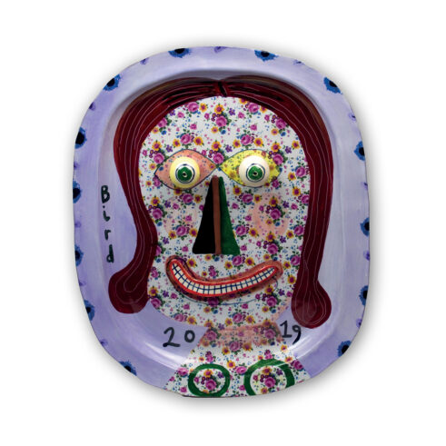 Smiling Woman With Floral Face Plate